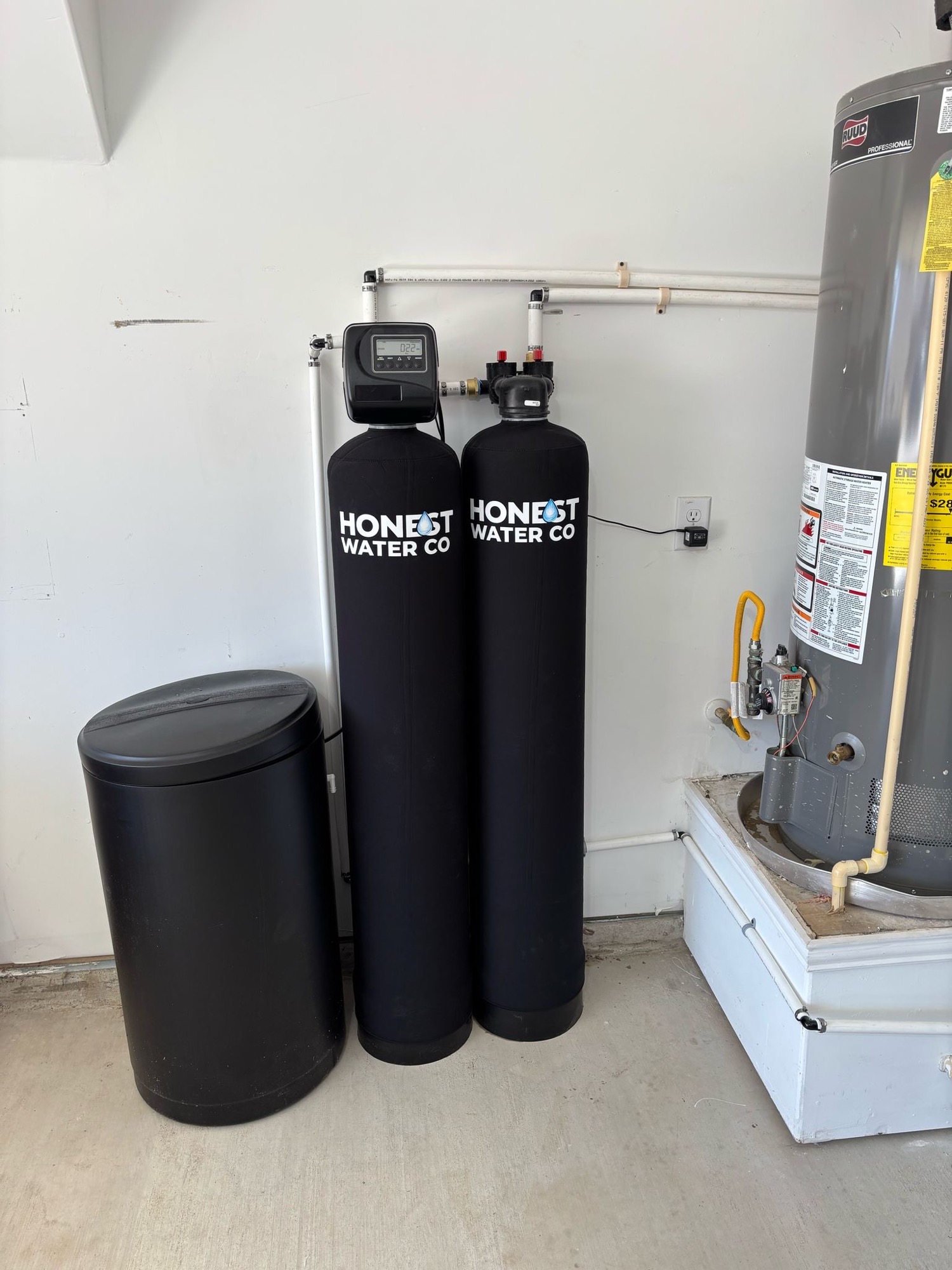 Two-tank system installed beside a water heater